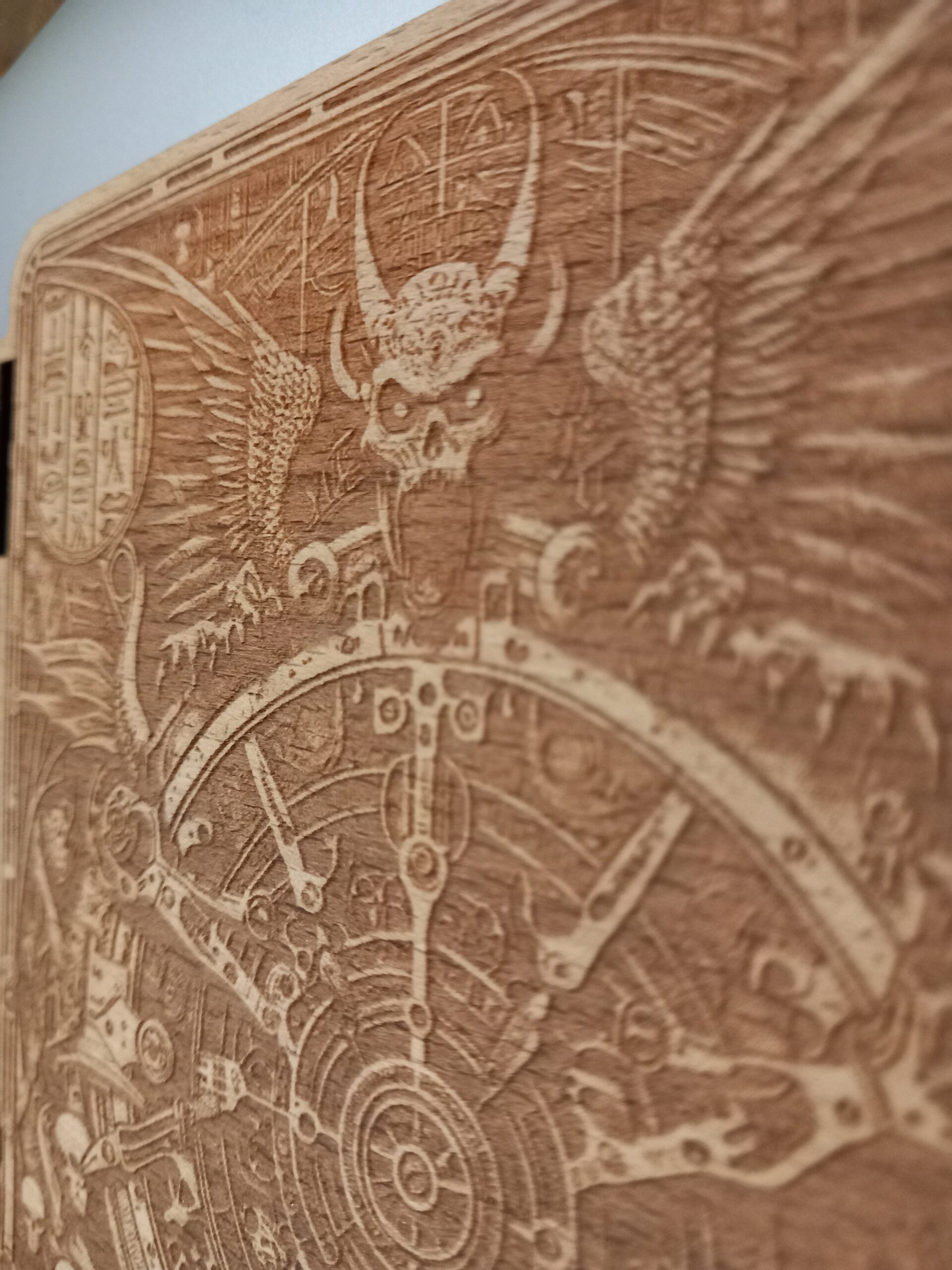 Detail of laser etched wooden book cover with demon 20240118 - LaserSister Kay Vincent