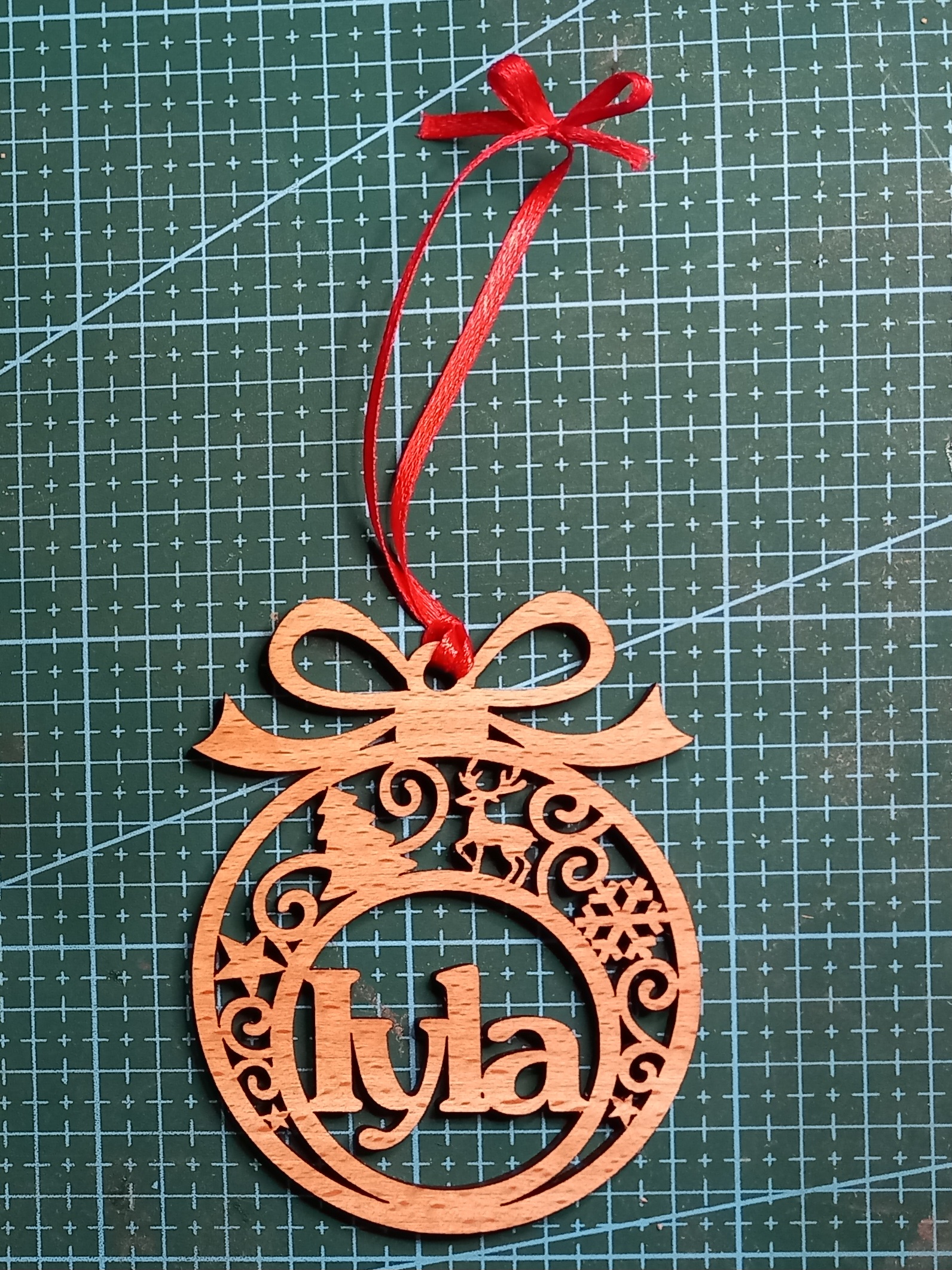 Personalised laser-cut wooden Iyla bauble by LaserSister - Kay Vincent 20251205