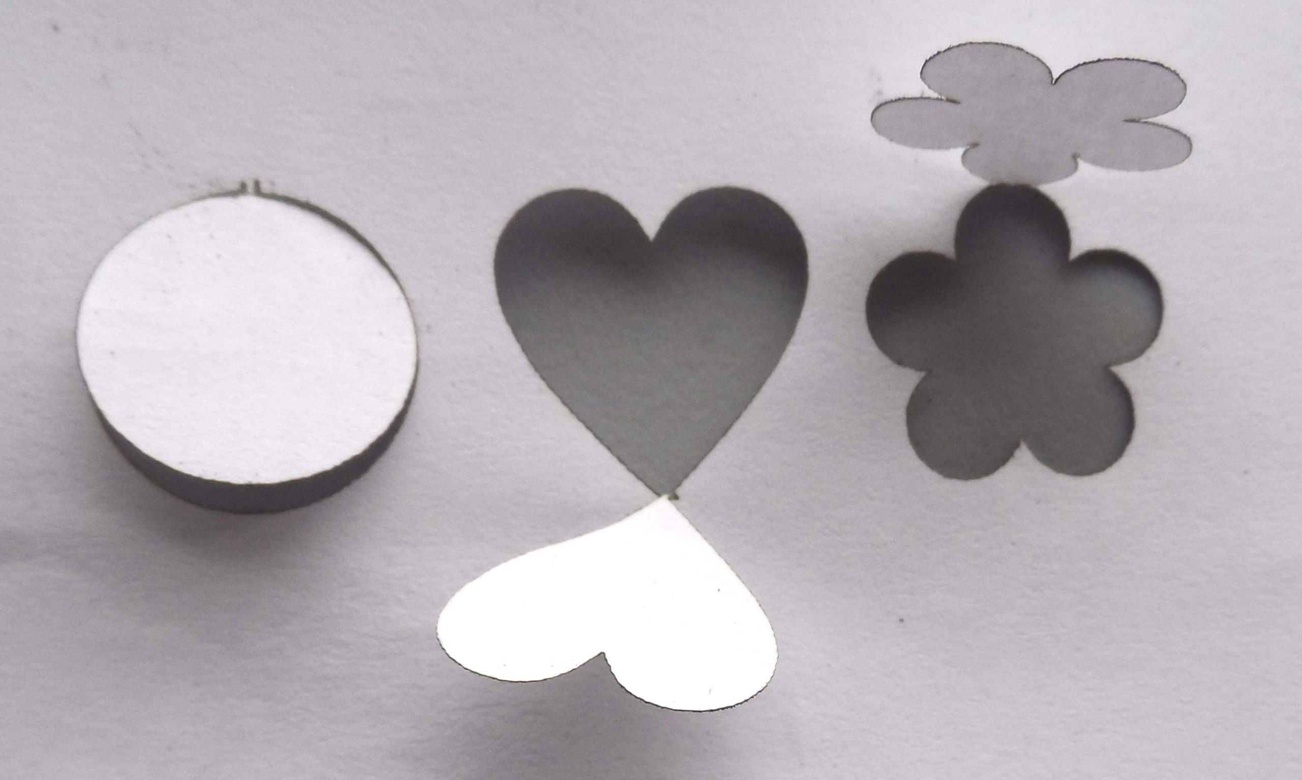 laser-cut items still attached to paper by sprues