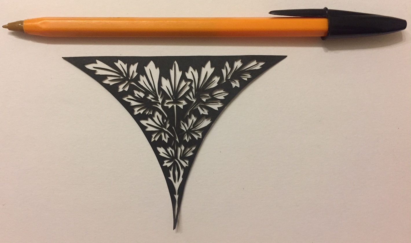 papercut 046 with pen for scale