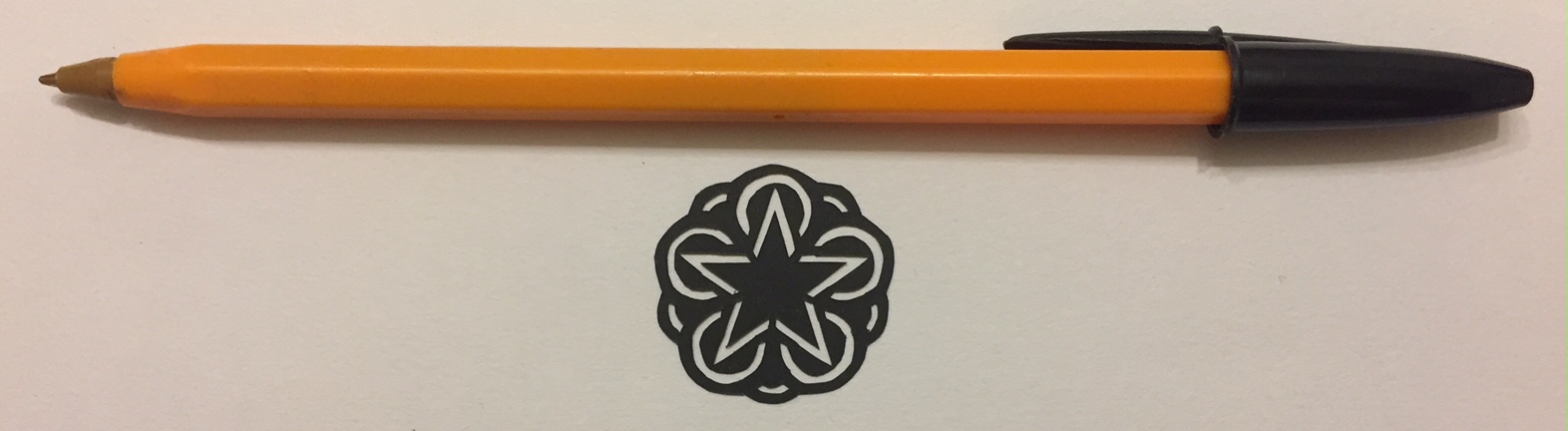 papercut 050 with pen for scale