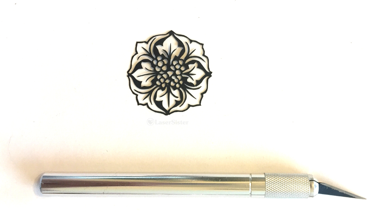 papercut 511 horizontal with scalpel - watermarked - LaserSister - KayVincent