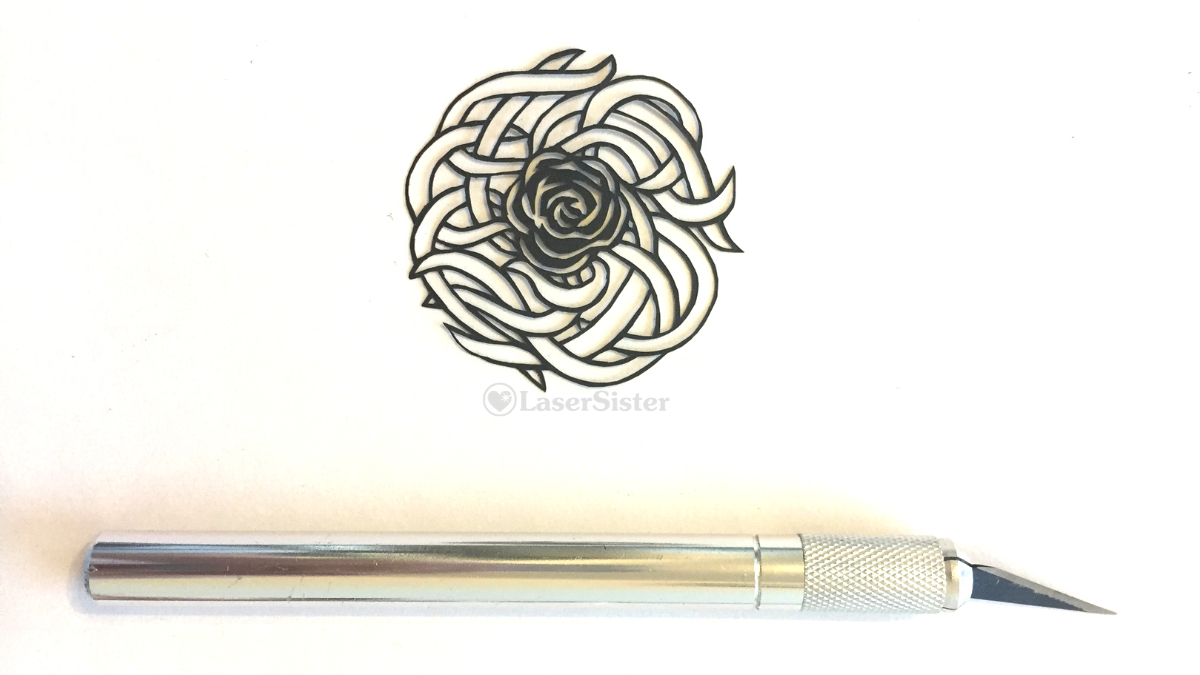 papercut 534 horizontal with scalpel - watermarked - LaserSister - KayVincent