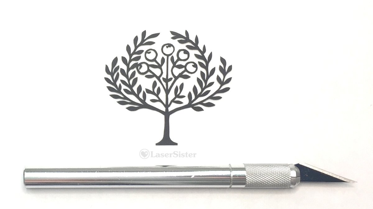 orange tree papercut - horizontal with scalpel for scale - Kay Vincent - LaserSister