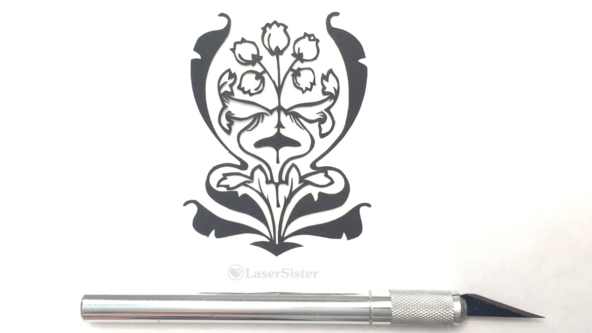lily of the valley papercut - with horizontal scalpel for scale - Kay Vincent - LaserSister