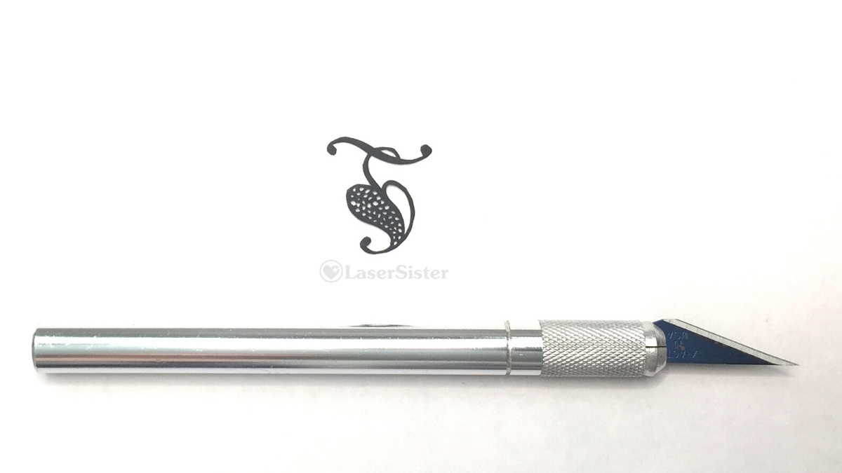 spotted leaf papercut - horizontal with scalpel - Kay Vincent LaserSister