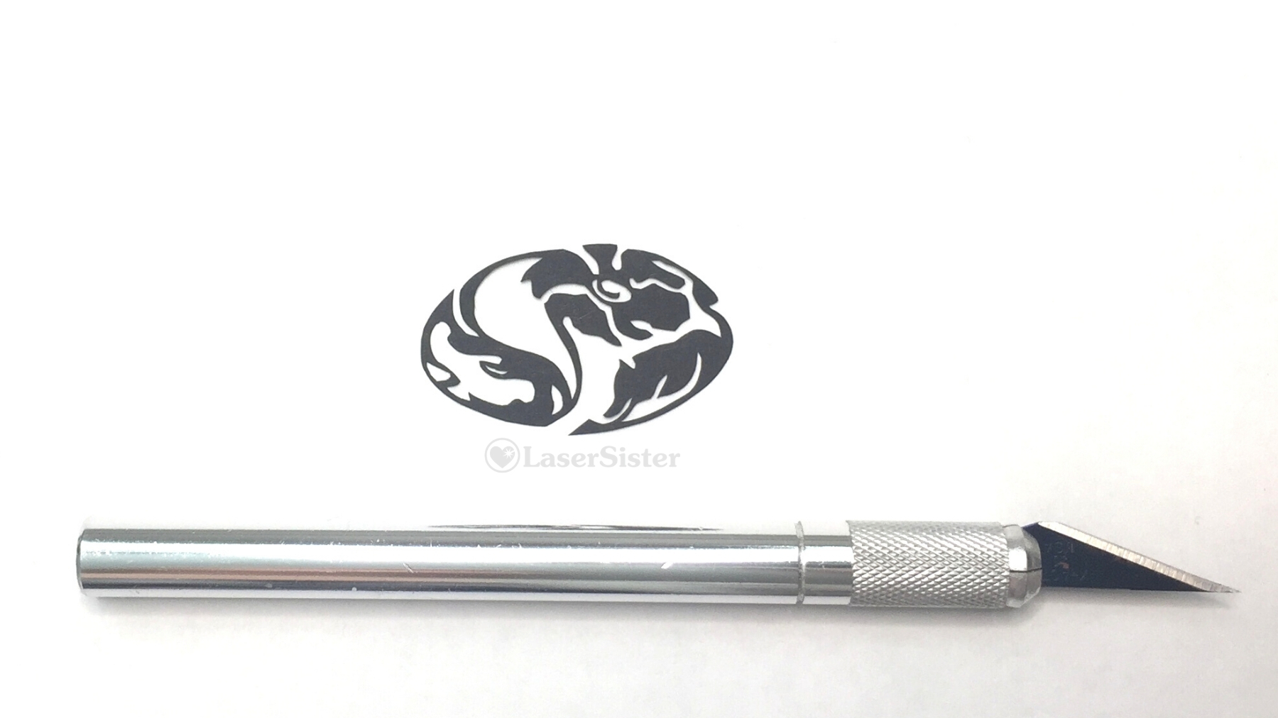 oval flower papercut - horizontal with scalpel - Kay Vincent LaserSister