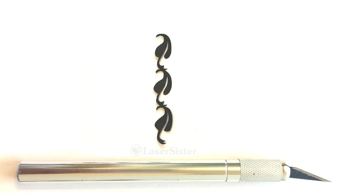 papercut 693 horizontal with scalpel - watermarked - LaserSister - KayVincent